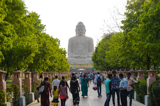 BODHGAYA, INDIA - MAY 26, 2017: Many Indian people go to the big Buddha monument
