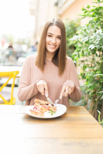istock Young beautiful woman in a cafe 1054102362