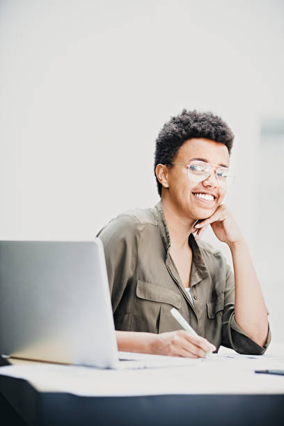 istock Smiling female architects using laptop and mobile phone 1054108156