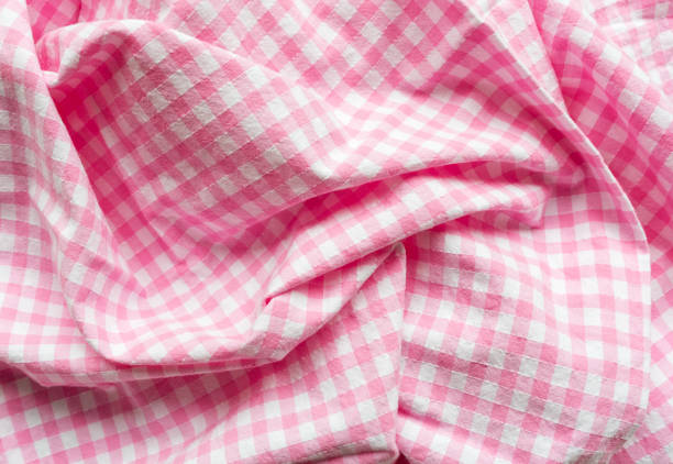 istock Full frame close up of crumpled pink gingham 1054110166