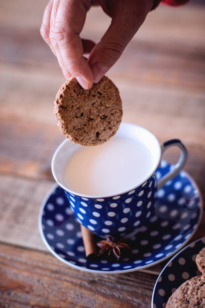 istock Sweet snack, tea cakes with cup of milk 1054114620