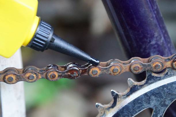 istock one colored plastic tube oils a rusty chain on a bicycle 1054119802