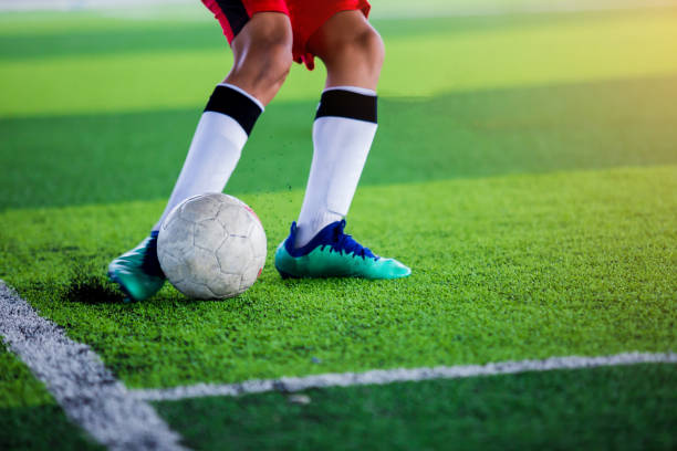 istock The kid Asian soccer player shoot ball 1054126604