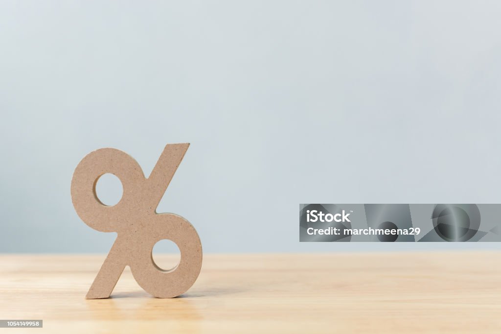 Percentage sign symbol icon wooden on wood table with white background Interest Rate Stock Photo