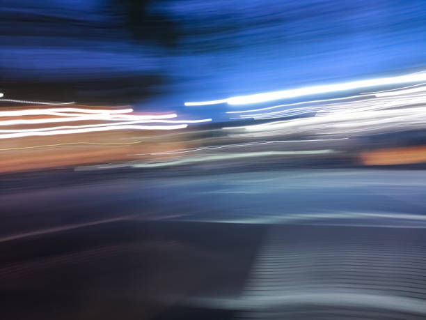 istock Abstract background with blue and white lines in motion and blurred effect 1054156304