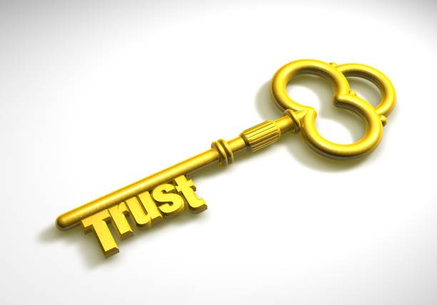 trust, is the key to success - in gold we trust imagens e fotografias de stock