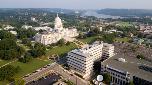 Aerial View State Capitol Building Grounds Arkansas River Little Rock The State Capitol of Little Rock stands lit by bright sunshine near dusk Arkansas River in the backgound arkansas stock pictures, royalty-free photos & images