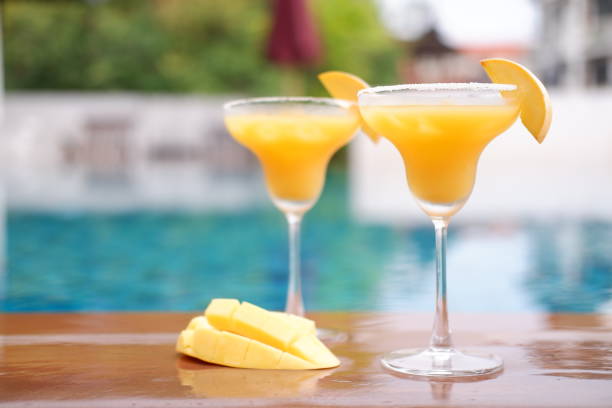 istock mango margarita at swimming pool 1054219990