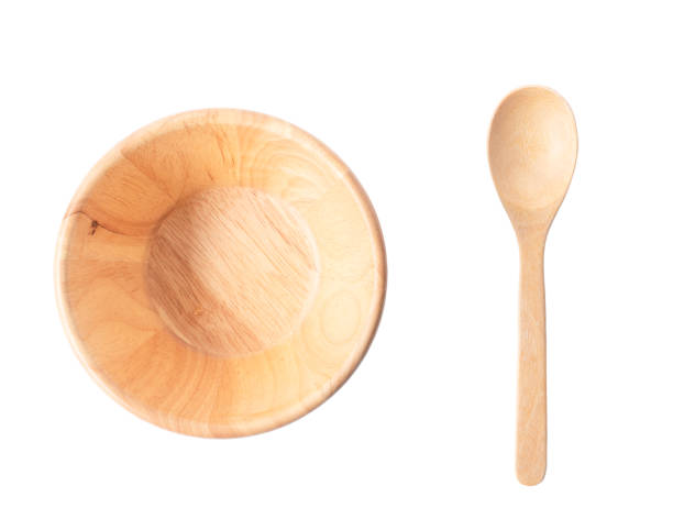 wooden bowl and spoon isolate on white background with clipping path stock photo