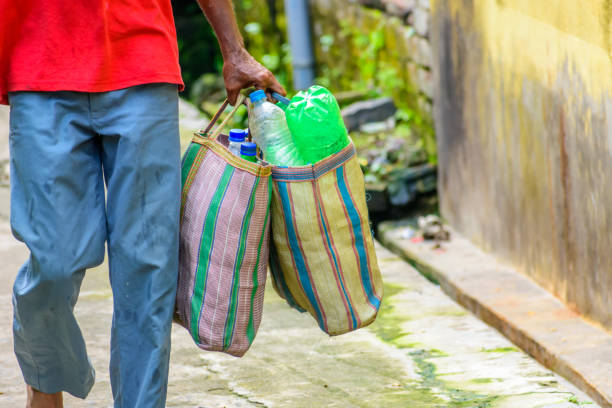 istock Plastic bottle are carrying out for recycling. 1054233030