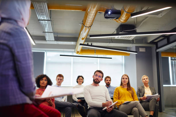 istock Muslim Businesswoman Holding Presentation 1054239040