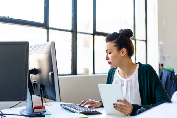 istock Businesswoman typing on keyboard at office 1054241486