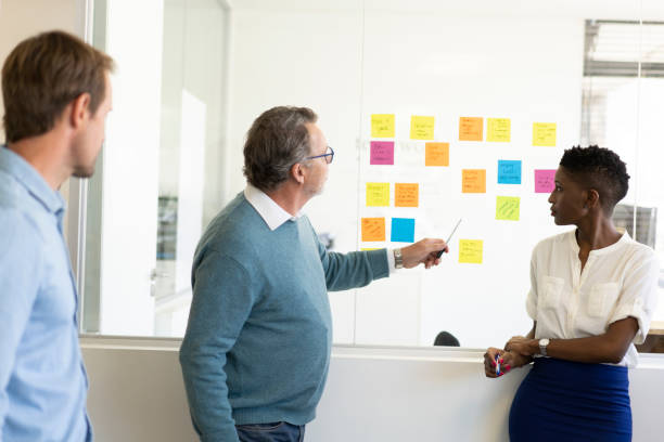 istock Senior businessman brainstorming colleagues 1054242194