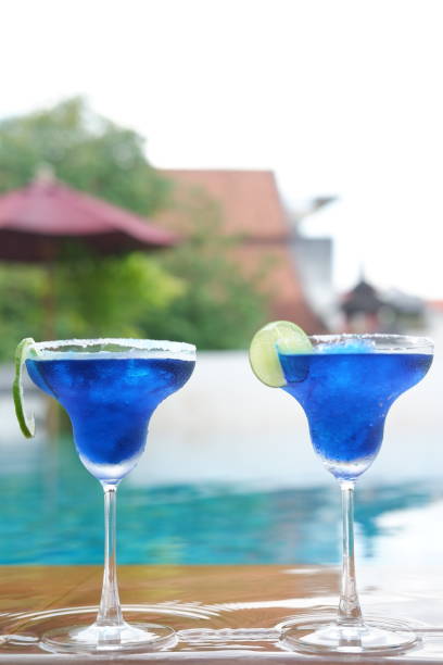 istock margarita cocktail at swimming pool 1054244518