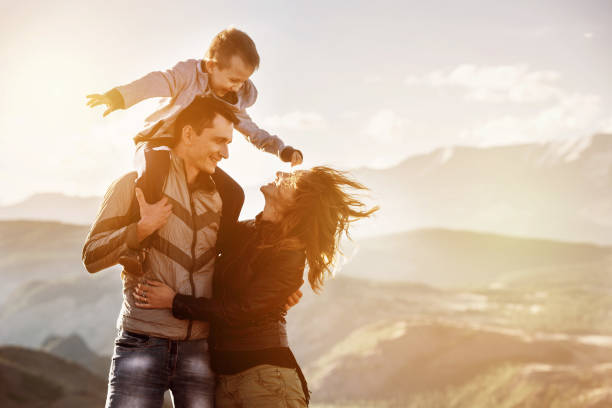istock Family child walking mountains sunset 1054247476