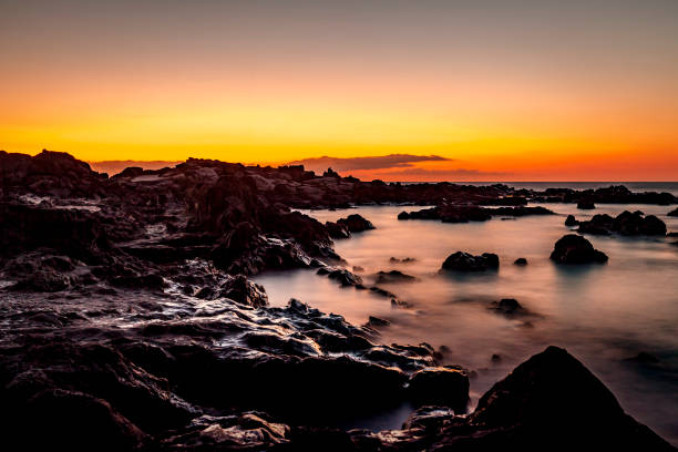 coral rocks and coral reefs at sunset, boucan canot beach, reunion island, french overseas territory, mascarene islands, france.