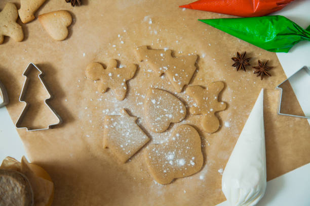 istock Cooking Christmas gingerbread cookies decorating for new year celebration 1054253746