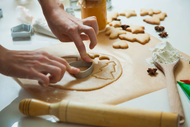 istock Cooking Christmas gingerbread cookies decorating for new year celebration 1054253792