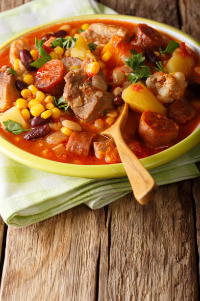 istock Cachupa stew with meat, chorizo and vegetables close-up in a plate. vertical 1054256010
