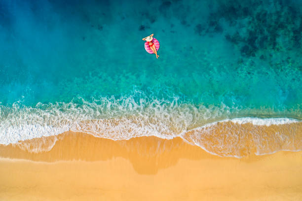 istock Swimming in clear turquoise sea 1054256340