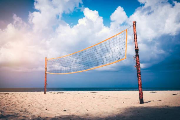 istock Volleyball court on an empty beach with blue cloudy sky. 1054258608