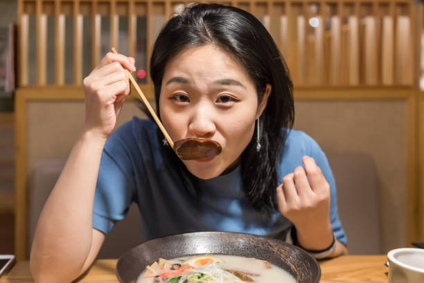 istock Girl in Japanese restaurant 1054258864
