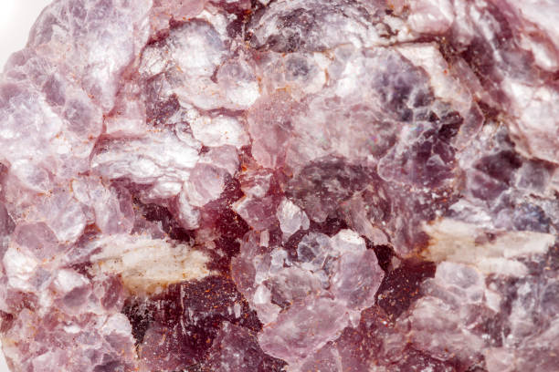 istock Macro mineral stone Lepidolite in the rock a white background 1054260782