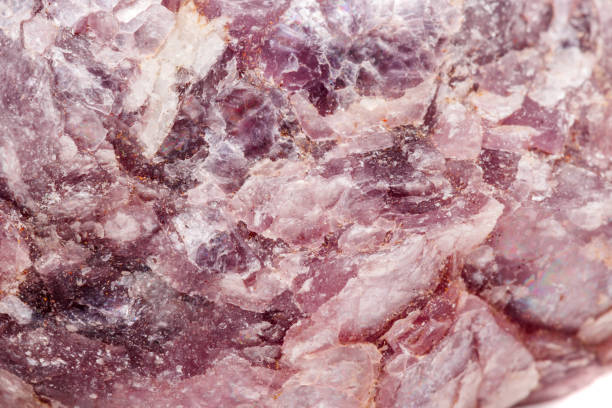istock Macro mineral stone Lepidolite in the rock a white background 1054260928