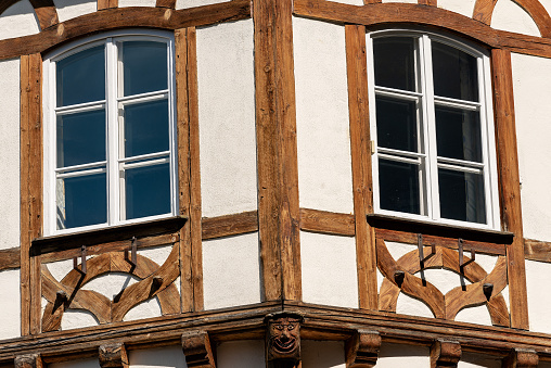 Close-up of an ancient half-timbered Bavarian typical house with wooden beams outside. Germany, Europe