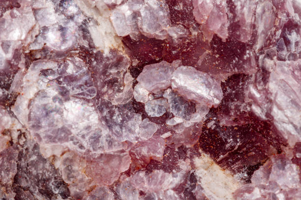 istock Macro mineral stone Lepidolite in the rock a white background 1054261254