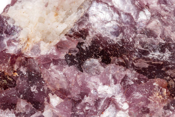 istock Macro mineral stone Lepidolite in the rock a white background 1054261342