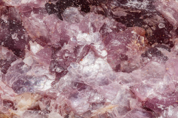 istock Macro mineral stone Lepidolite in the rock a white background 1054261352