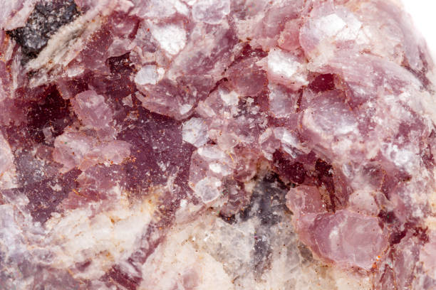 istock Macro mineral stone Lepidolite in the rock a white background 1054261636