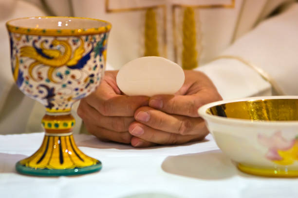 istock hands of the pope celebrated the Eucharist 1054263830