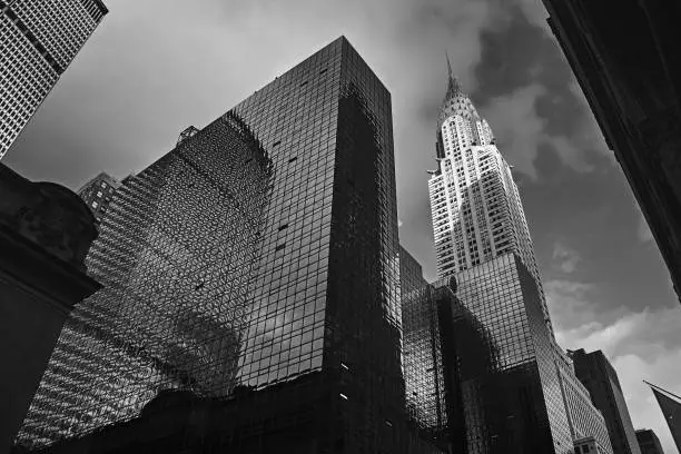 Skyline of midtown Manhattan in New York City with landmark skyscrapers in black and white.