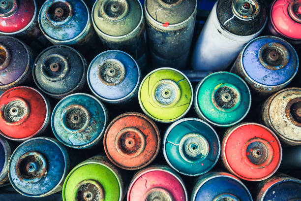 multicolor spray cans used for writing Spray cans photographed from above, you see all the colors usable. streetart stock pictures, royalty-free photos & images