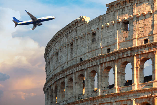 istock Coliseum in Rome Close Up with Airplane 1054300094