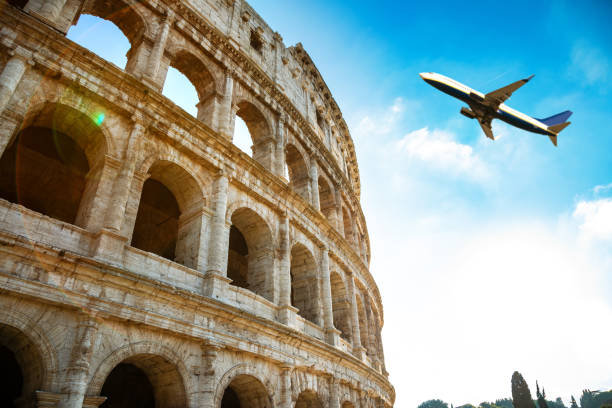 Coliseum in Rome Close Up with Airplane stock photo