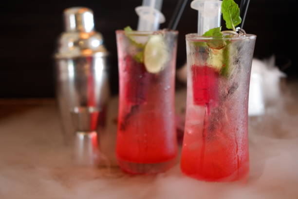 istock cocktail on old wooden and smoke drinks 1054306736