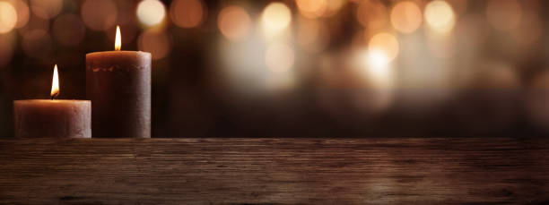 istock Candles with wooden table and bokeh background 1054310178