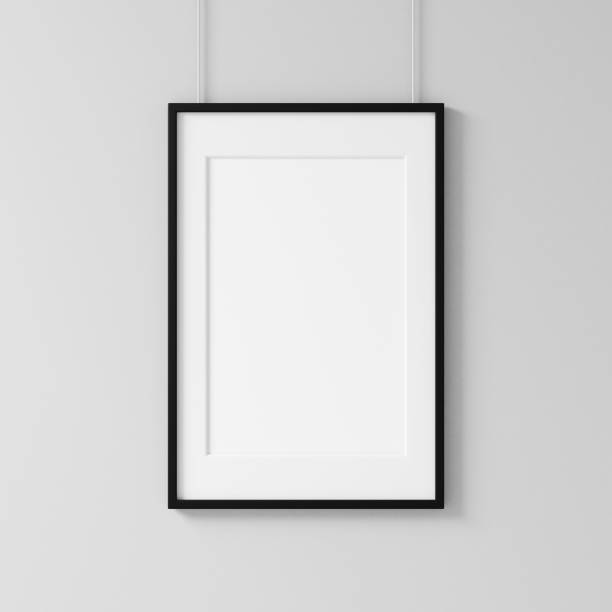 istock White poster with black frame mockup hanging on the wall 1054312526