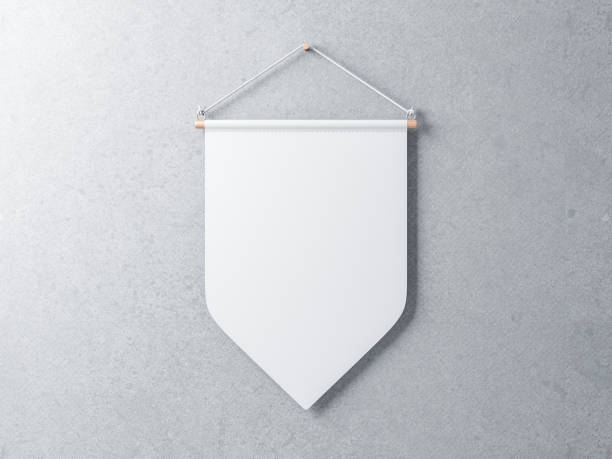 White Pennant hanging on a gray concrete wall