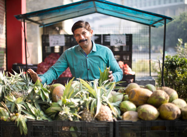 istock Man selling pineapple and coconut 1054316500