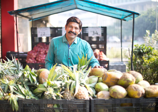 istock Man selling pineapple and coconut 1054317226