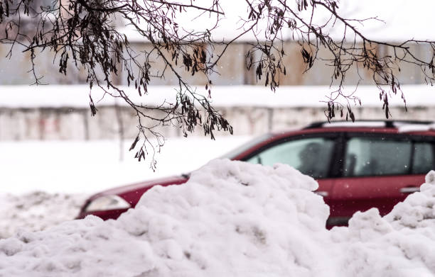 istock Snow drift along the road. Winter urban view. Selective focus 1054317400