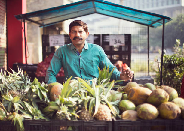istock Man selling pineapple and coconut 1054317576