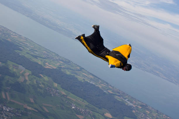 Wingsuit flier dives mid-air