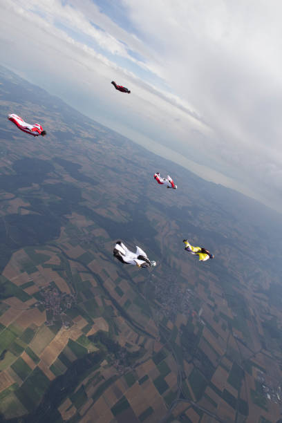 istock Wingsuiters dive through mid air 1054319386
