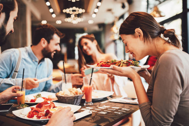istock Group of Happy friends having breakfast in the restaurant 1054322930