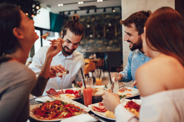 istock Group of Happy friends having breakfast in the restaurant 1054324938